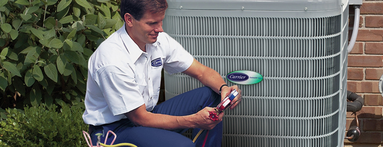 acmaintenance Carrier technician checking air conditioner